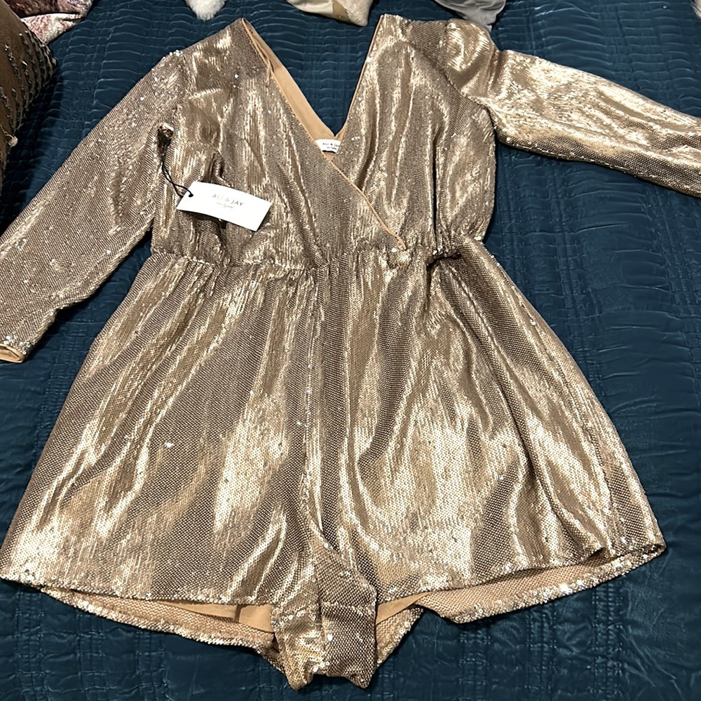 Never worn, tag still on. Ali and Jay gold sequin romper.